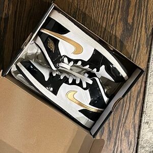 Black and White Sneakers with Gold Accents